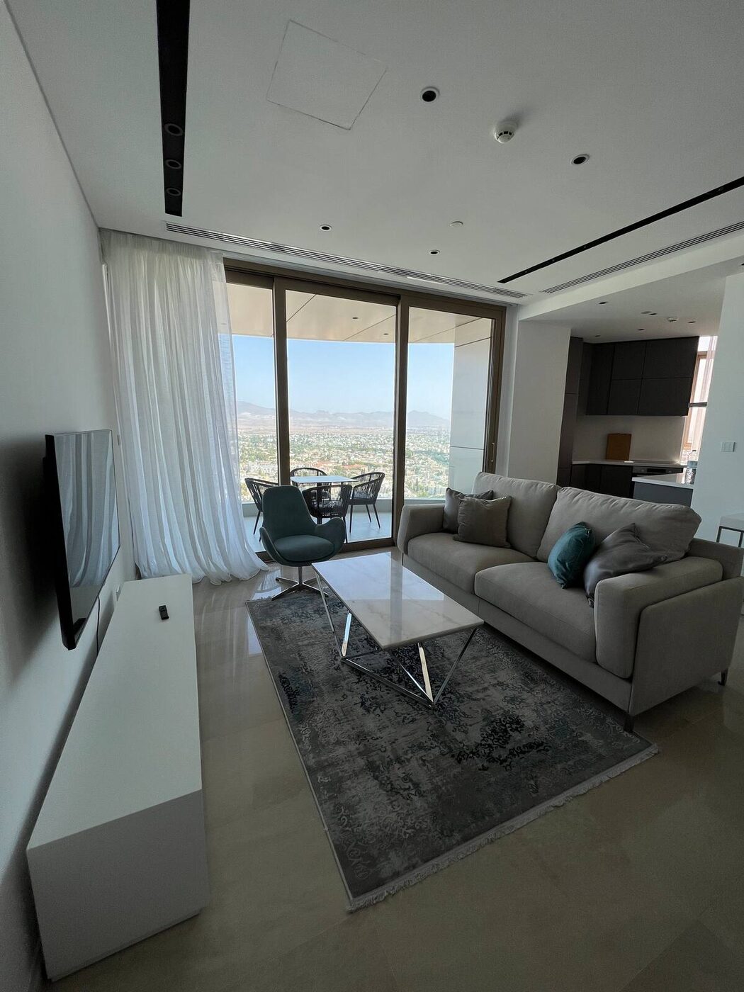 Living room with floor to ceiling windows over Nicosia