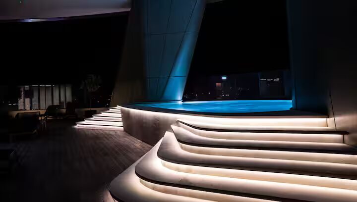 The pool lit up at night